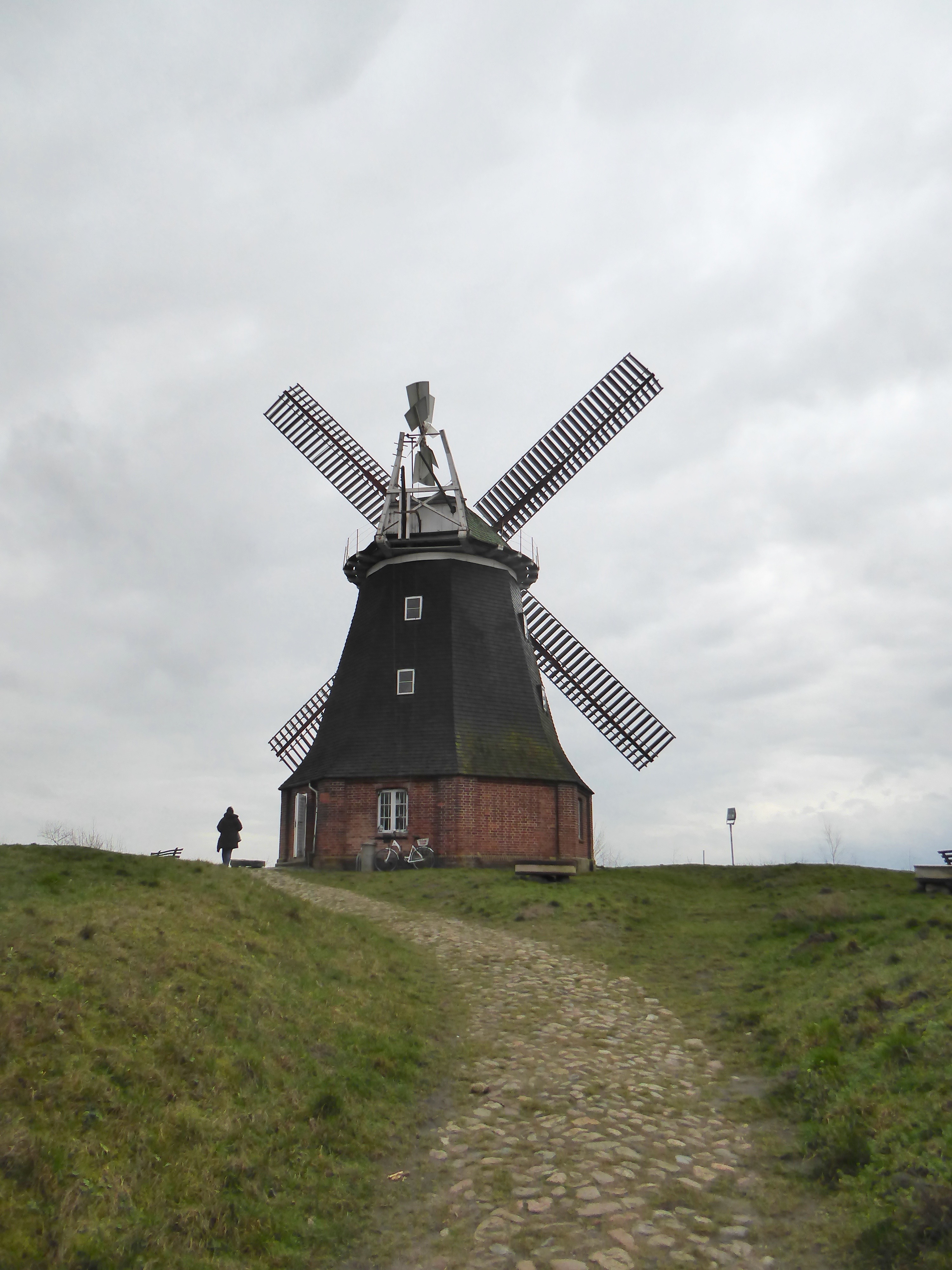  Outdoors, Person, Engine, Machine, Motor, Bicycle, Transportation, Vehicle, Windmill, Architecture, Beacon, Building, Lighthouse, Tower