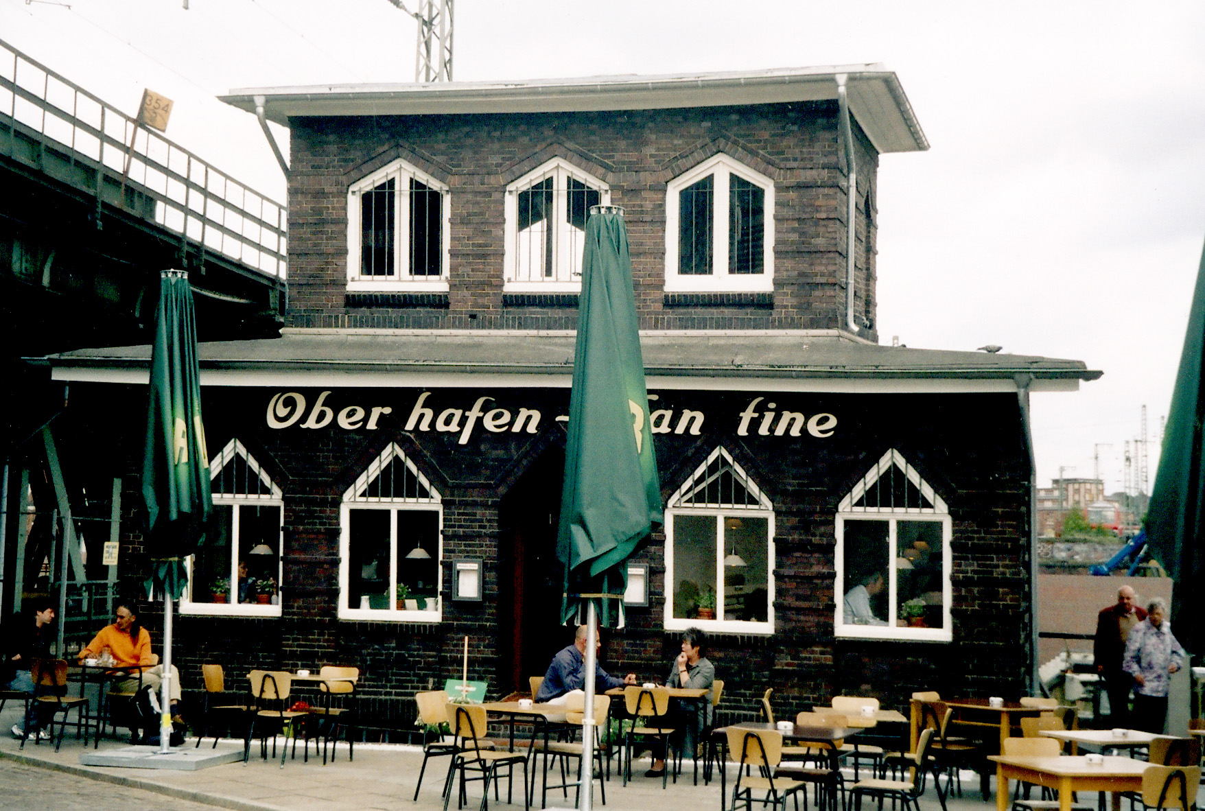 Cafe, Indoors, Restaurant, Cafeteria, Architecture, Building, Person, Chair, Furniture, Neighborhood, Table, Dining Table