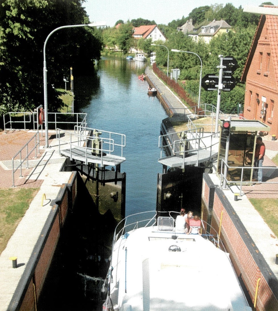  Canal, Outdoors, Water, Waterfront, Path, City, Towpath, Neighborhood, Person, Road, Street, Urban, Transportation, Vehicle, Watercraft, Nature, Scenery, Boat, Architecture, Building, Arch, Port, Car